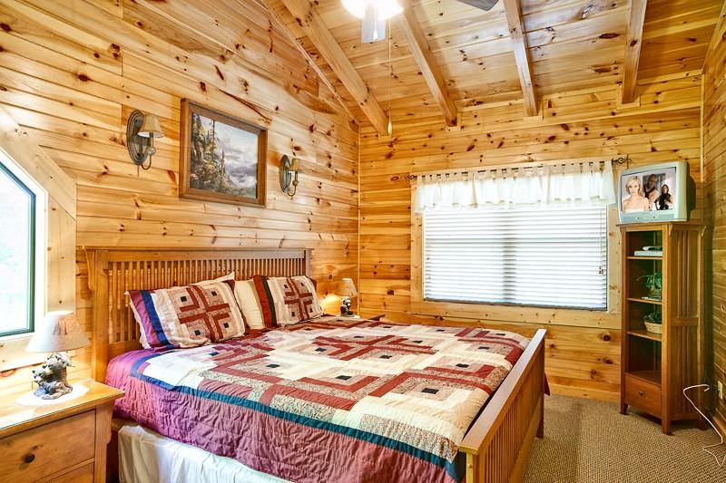 Bedroom with king size bed and TV